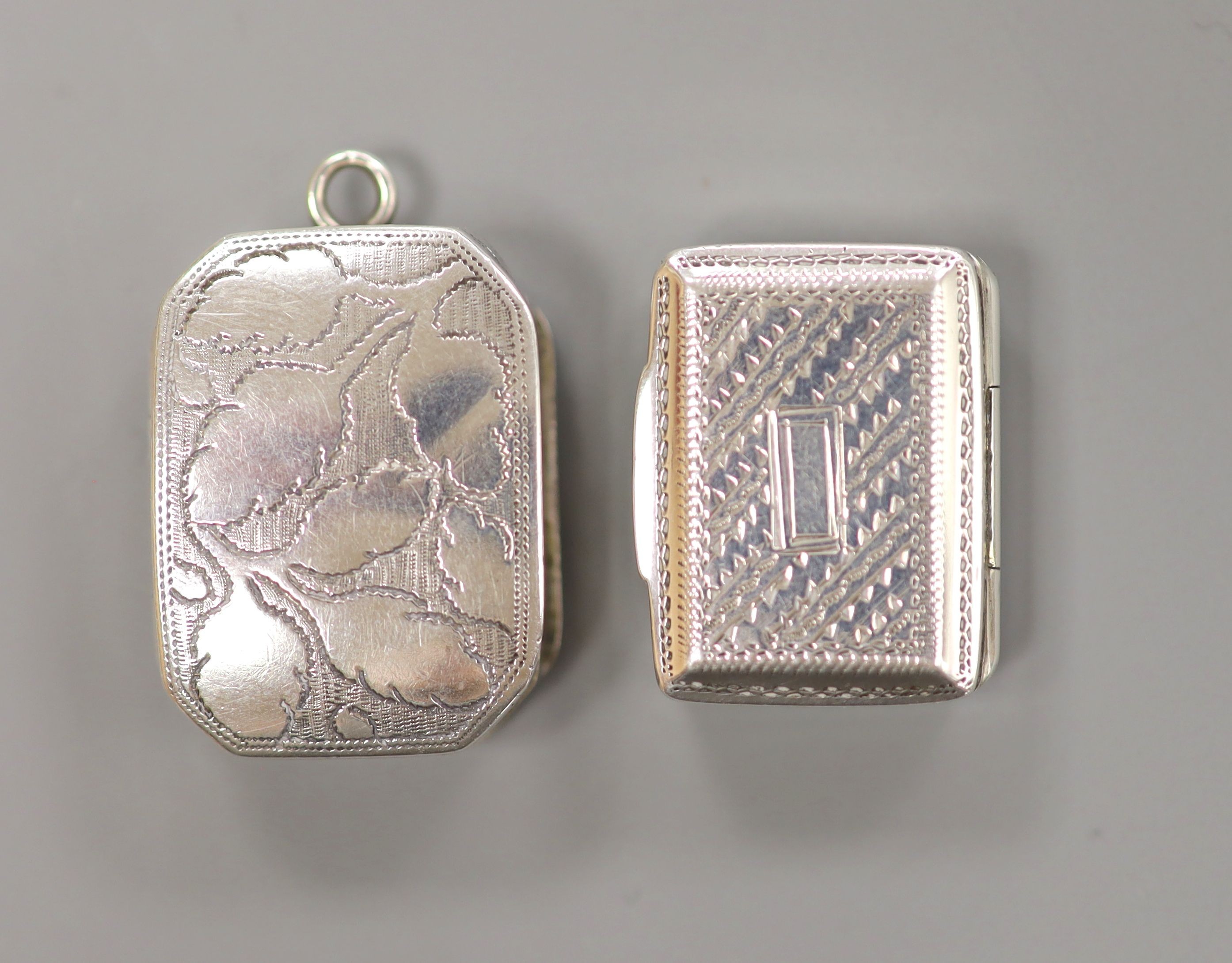A George III silver vinaigrette, Samuel Pemberton, Birmingham, 1810, 25mm and a William IV silver vinaigrette, Joseph Betteridge, Birmingham, 1830, 21mm.